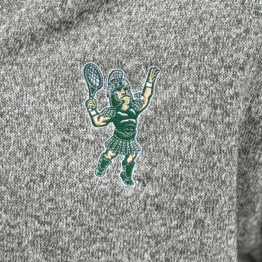 Close up of the embroidered Sparty playing tennis on the upper left chest of the full zip jacket.