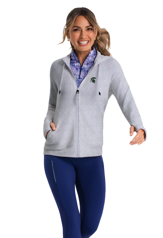 Woman wearing a light gray full-zip jacket with a drawstring hood, a pocket on either side, thumb holes at the end of the sleeves, and a green Spartan Helmet logo on the upper left chest. 