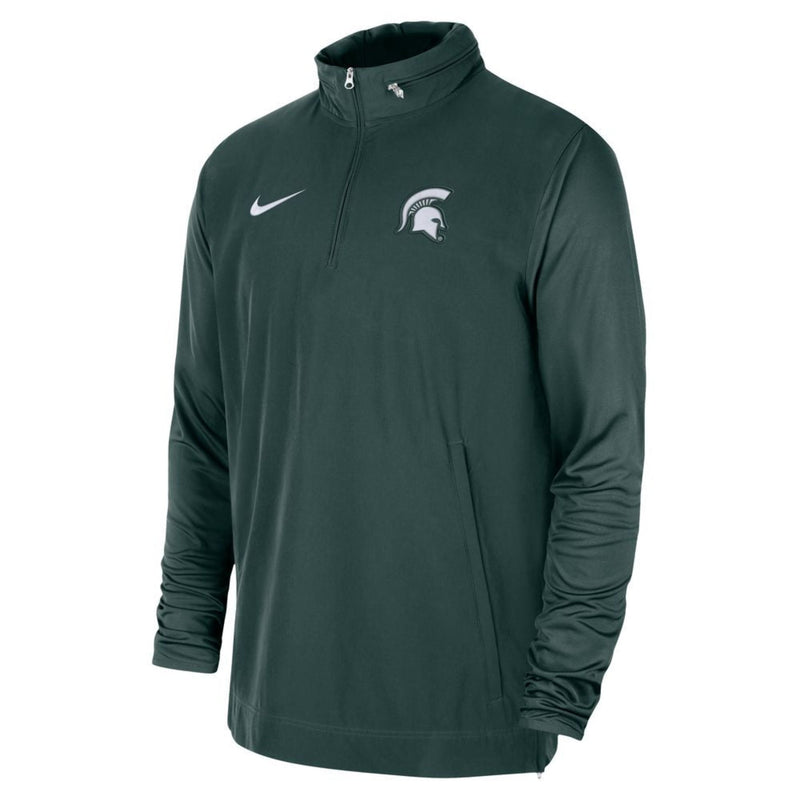 A dark green quarter-zip jacket with a white Spartan helmet logo on the upper left chest and a white Nike swoosh on the upper right.