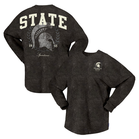 A dark charcoal gray mineral washed long-sleeve t-shirt shown from both the front and back. The back features a large cream graphic with the word 'STATE' above a Spartan helmet design, flanked by '18' and '55' and the word 'Spartans'.