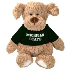 Light brown dog plush wearing a green 'Michigan State' shirt, with floppy ears, a dark brown nose, and white paws.