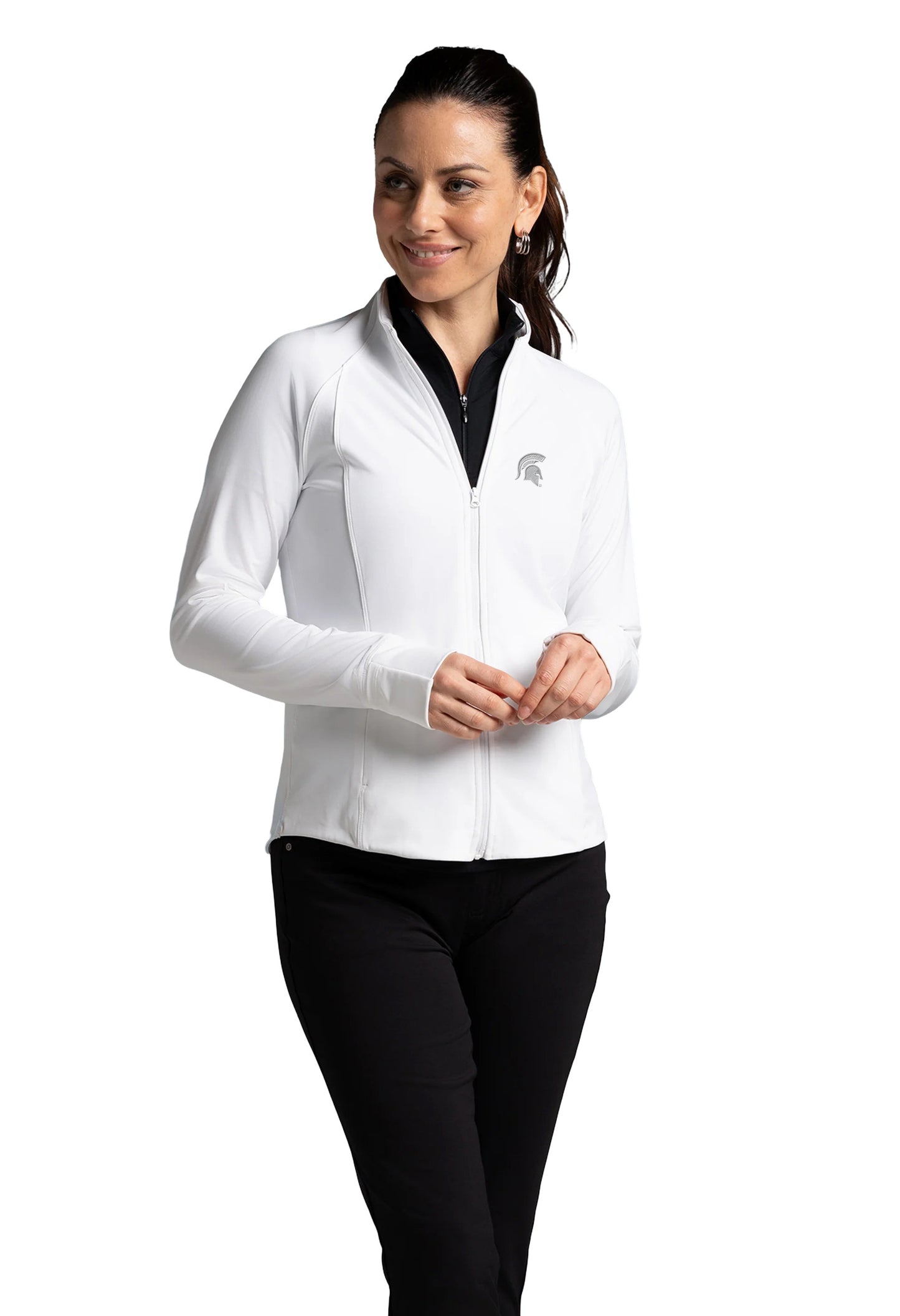 Woman wearing a white fitted, full-zip jacket with a gray Spartan Helmet logo on the upper left chest. 