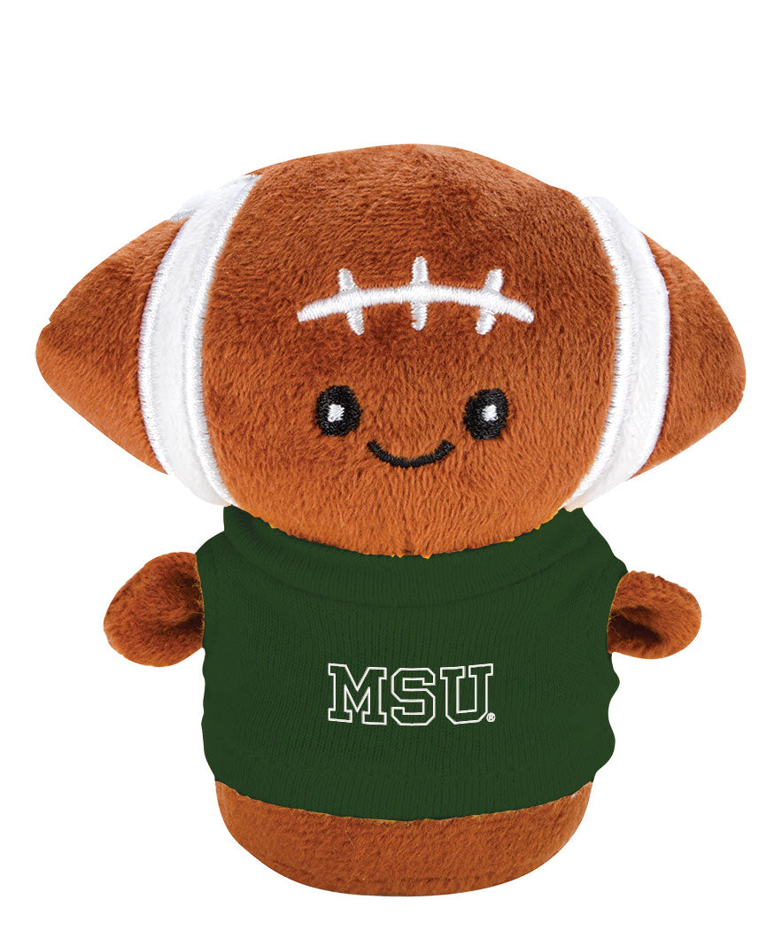 Stuffed mini football with a face and body. It is wearing a green T-shirt with a white MSU wordmark printed on the front. 