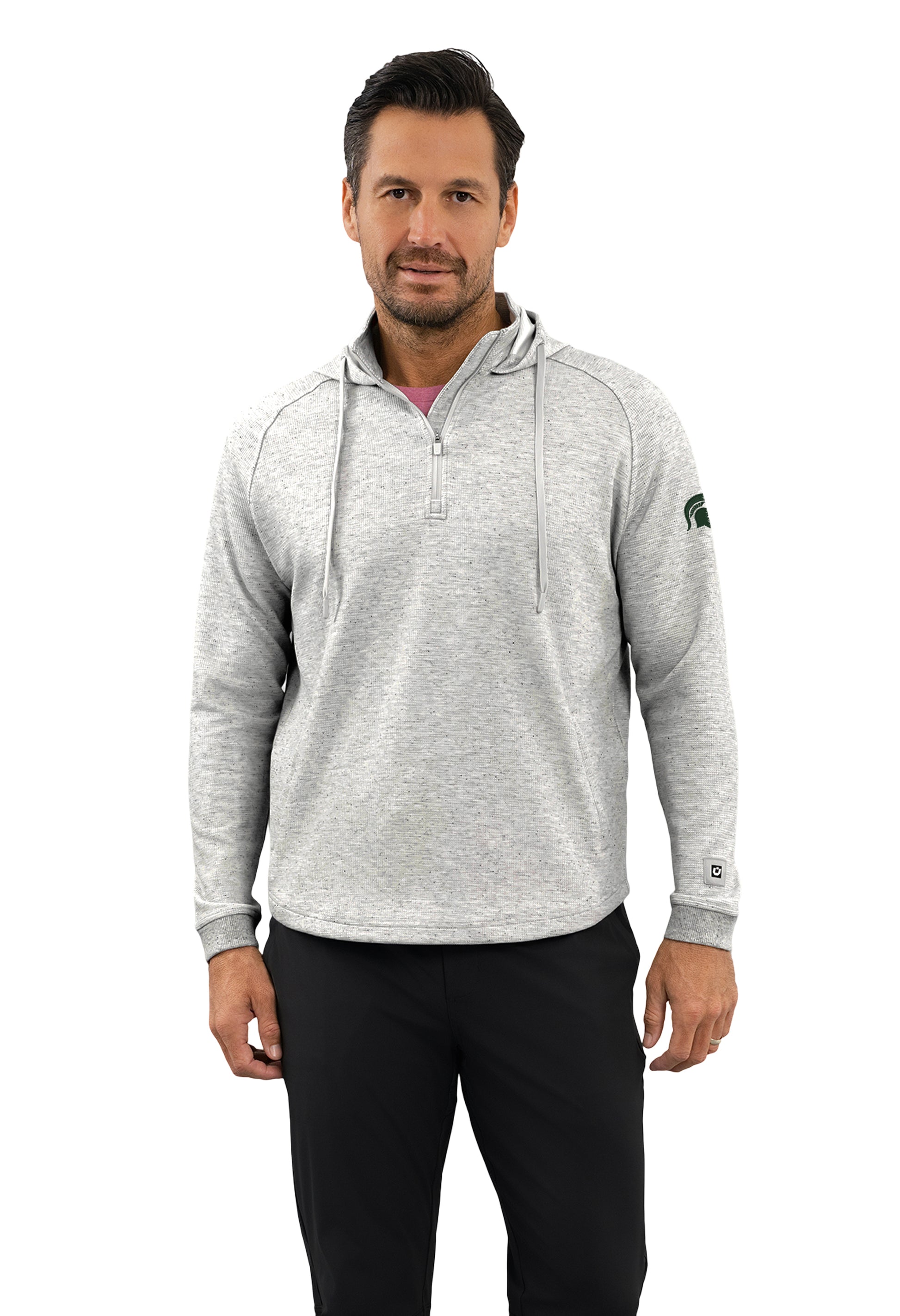 Person wearing a light grey heathered waffle knit quarter zip hoodie. Green embroidered Spartan helmet on left sleeve near bicep area. 