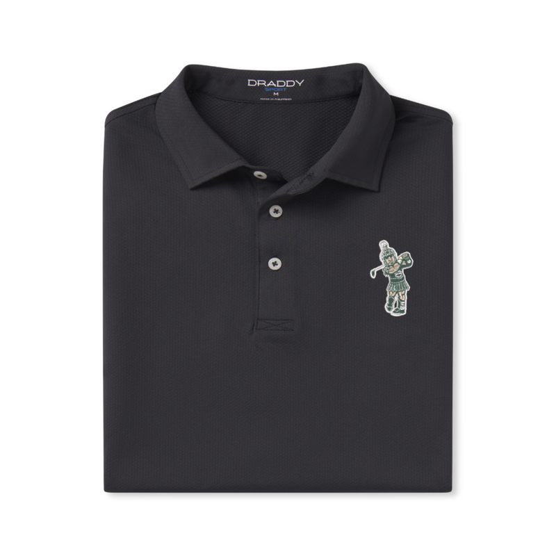Black DRADDY polo shirt neatly folded, featuring a collar with three buttons and an embroidered patch of a golfing Sparty in green swinging a club on the left chest.