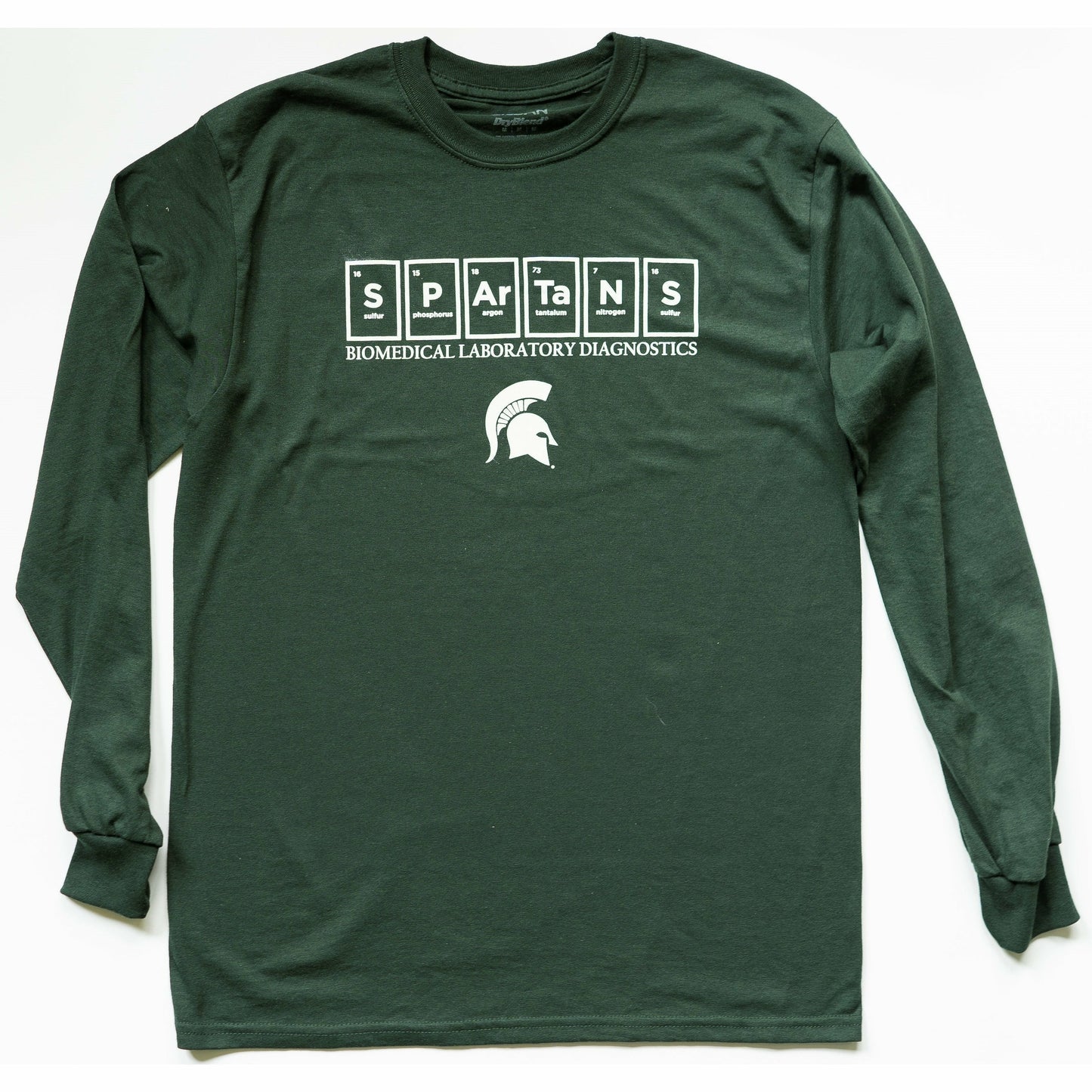 Forest green crewneck T-shirt with long sleeves. On the center chest are six periodic table elements spelling out Spartans. Underneath, Biomedical Laboratory Diagnostics is written in all caps with a Spartan Helmet centered underneath. All printing is in white.