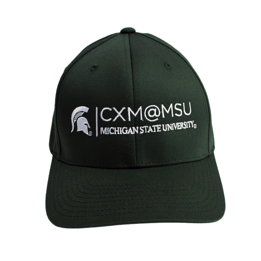 Front of a green baseball cap embroidered with the CXM@MSU signature logo and Spartan Helmet logo, both in white.