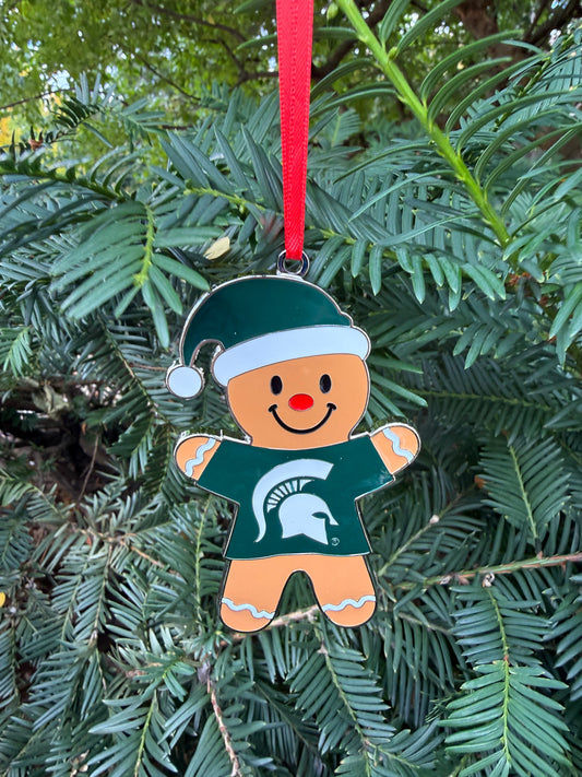 Decorative gingerbread man ornament with a green and white festive hat on and green T-shirt with a white Spartan helmet logo on the front. 