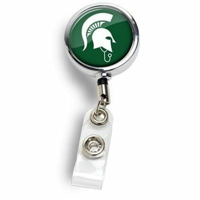 Silver badge reel with a clear folded clip. The face of the reel is dark green with a white Sparty MD logo (Spartan Helmet wearing a stethoscope).