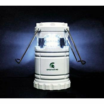White pop-up camping lantern with a green Spartan Helmet printed above green text reading "Spartan MD."
