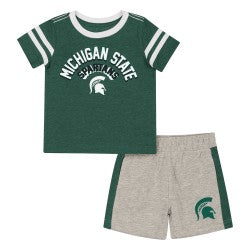 Toddler Michigan State Spartans two-piece outfit featuring a heather green short-sleeve T-shirt with white sleeve stripes, arched "Michigan State" text, and Spartans logo on the front, paired with heather gray athletic shorts with green side panels and a Michigan State Spartans logo on the left leg.