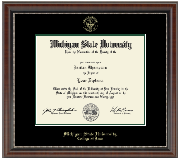 The diploma is displayed in a dark wood frame with green accents and a black matte. "Michigan State University, College of Law" is printed in gold lettering at the bottom of the frame. Gold embossed Michigan State University seal. 