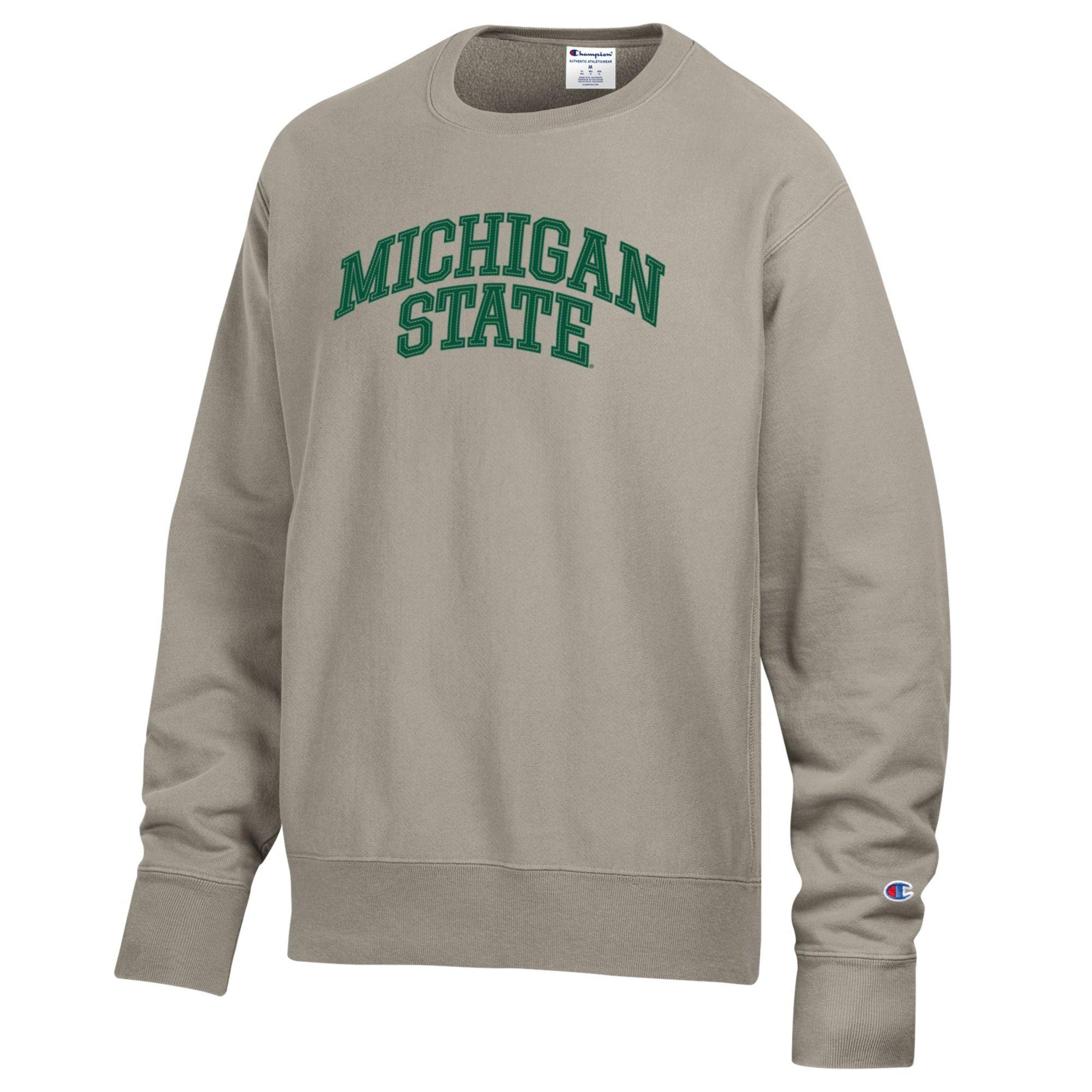 A beige crewneck with the words "Michigan State" on the chest in green.