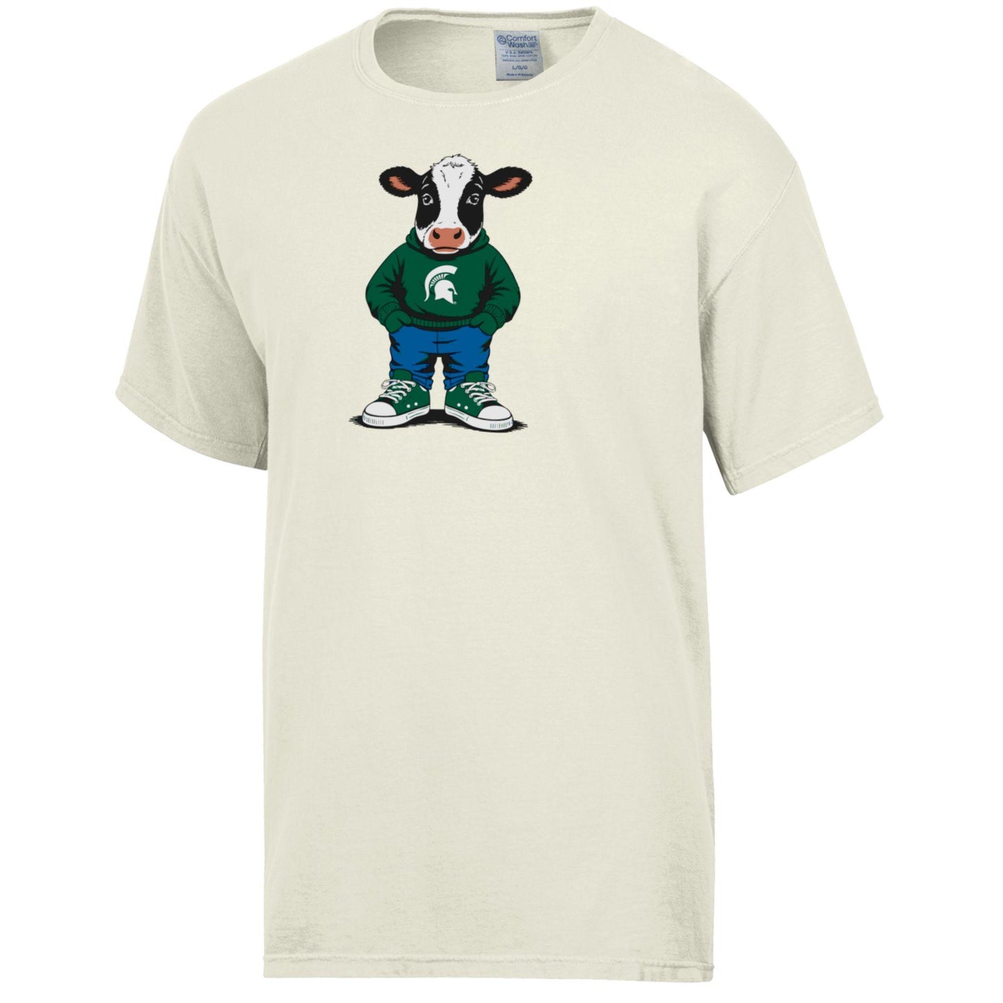 Cream T-shirt with a printed cow graphic, wearing a green sweatshirt with a white Spartan Helmet logo, blue pants, and green and white shoes.