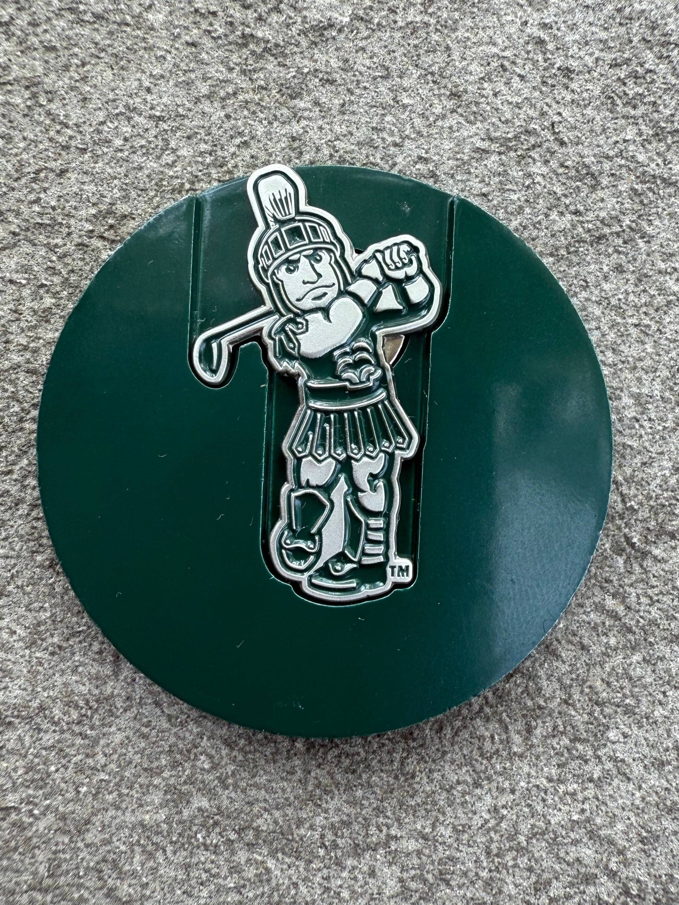 White magnetic Sparty golf ball marker.