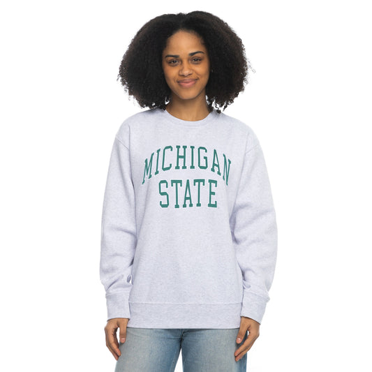 Person in light gray 'Michigan State' sweatshirt and light blue jeans.