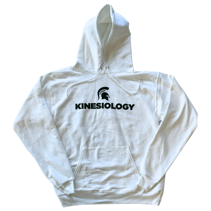White hooded sweatshirt with green text that reads "Kinesiology" and a green Spartan Helmet logo above the text. The sweatshirt has a large pocket on the front and drawstrings on the hood.