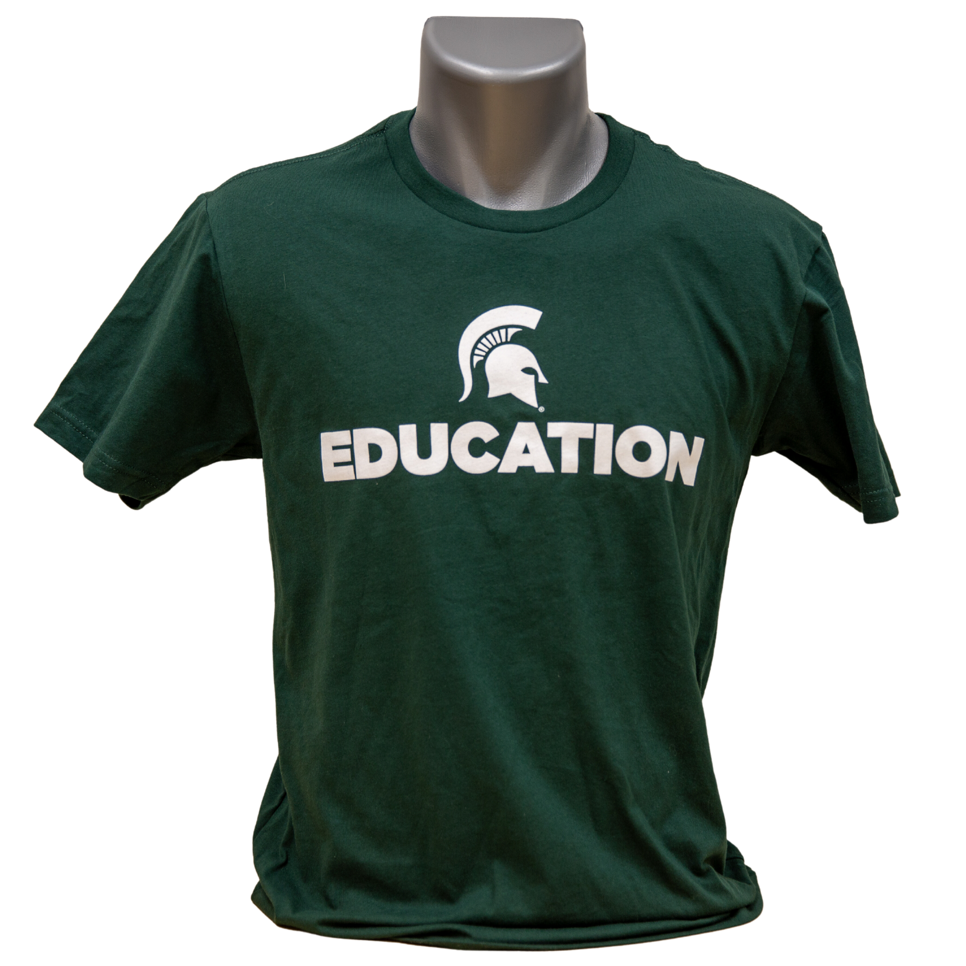 Forest green short-sleeve women's crewneck T-shirt with a white Spartan Helmet logo above text reading "Education" in all caps. Shown on a mannequin. 