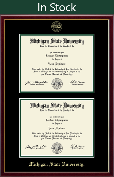 A frame that is rectangular to fit two diplomas in it. It has black matting and green acescent around the opening of the diploma. Frame color is a rich dark cherry red with a gold inner lip. At top of matting is gold embossed Michigan State University Seal. At the bottom is in gold cursive font is 'Michigan State University'.