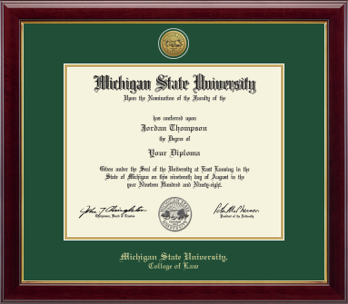 The diploma is displayed in a dark wood frame with a green matte and gold trim, and includes signatures from university officials. In gold and cursive writing is "Michigan State University." Below in gold cursive letters is "College of Law."