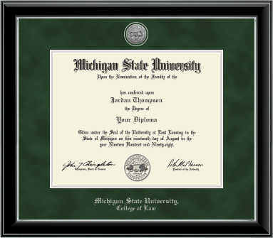 The diploma is enclosed in a black frame with silver accents and set against a green suede matte with silver outline around opening for diploma. Top of matting is silver engraved Michigan State University seal. Silver cursive letters is "Michigan State University" at bottom. Below in silver cursive letters "College of Law."