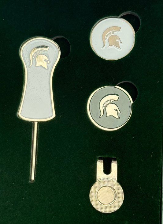 Divot tool that is silver outlined with white center and a silver helmet towards top of handle. Two round ball makers one is white with a silver Spartan helmet other is green with silver spartan helmet. Silver magnetic ball maker clip that clips on to bill of hat. 