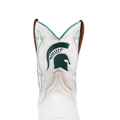 A close-up of a white leather cowboy boot featuring the Michigan State University Spartan logo embroidered in dark green on the shaft, with light green western-style stitching and a brown pull tab.