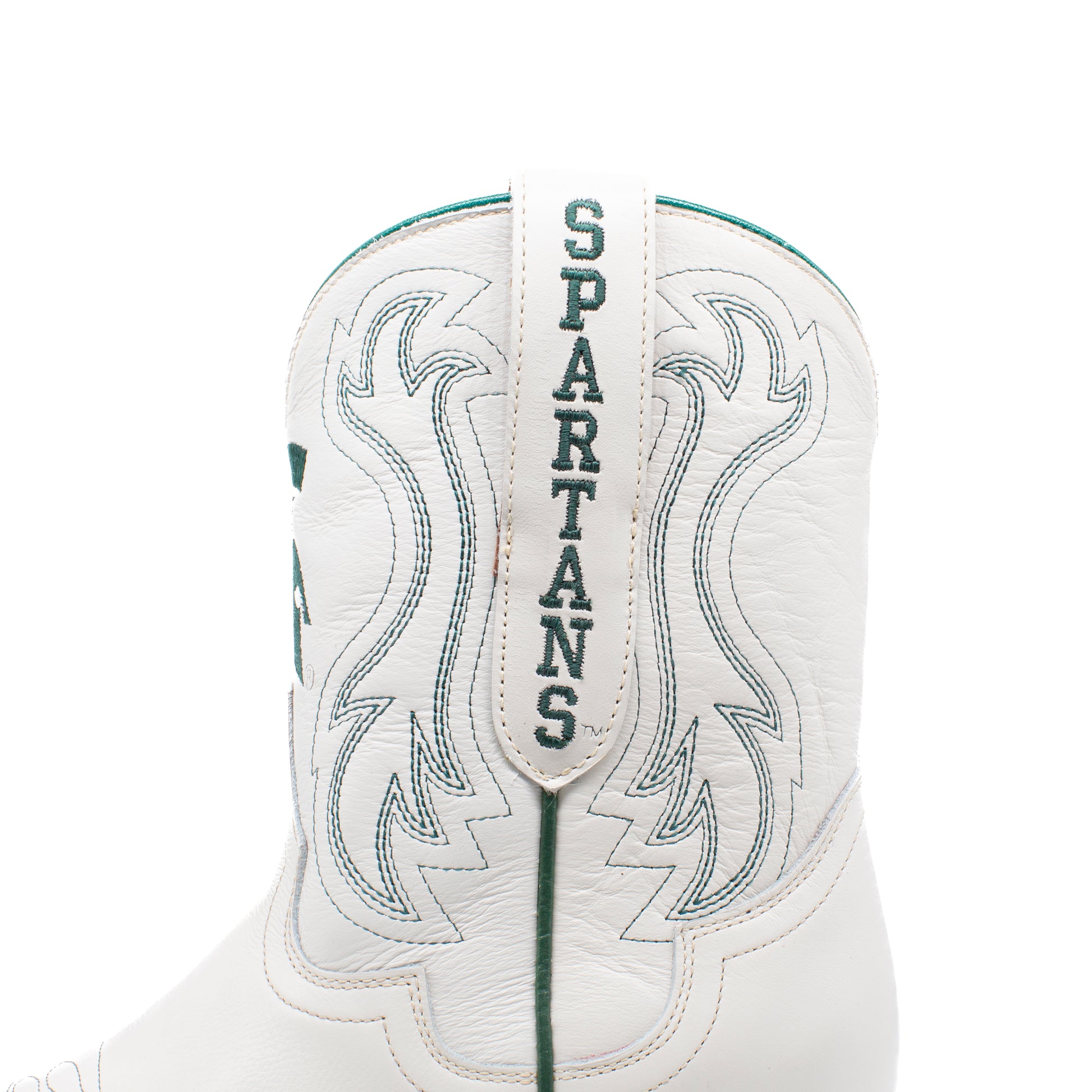 Close-up of the back shaft of a white leather cowboy boot with green embroidered western stitching and the word 'SPARTANS' stitched vertically on the pull tab.