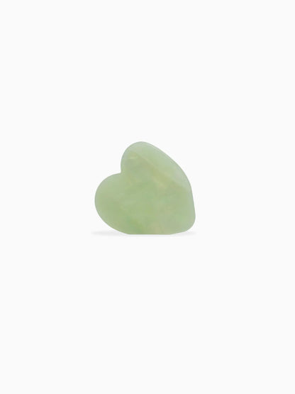 Heart-shaped light green plastic hairclip.