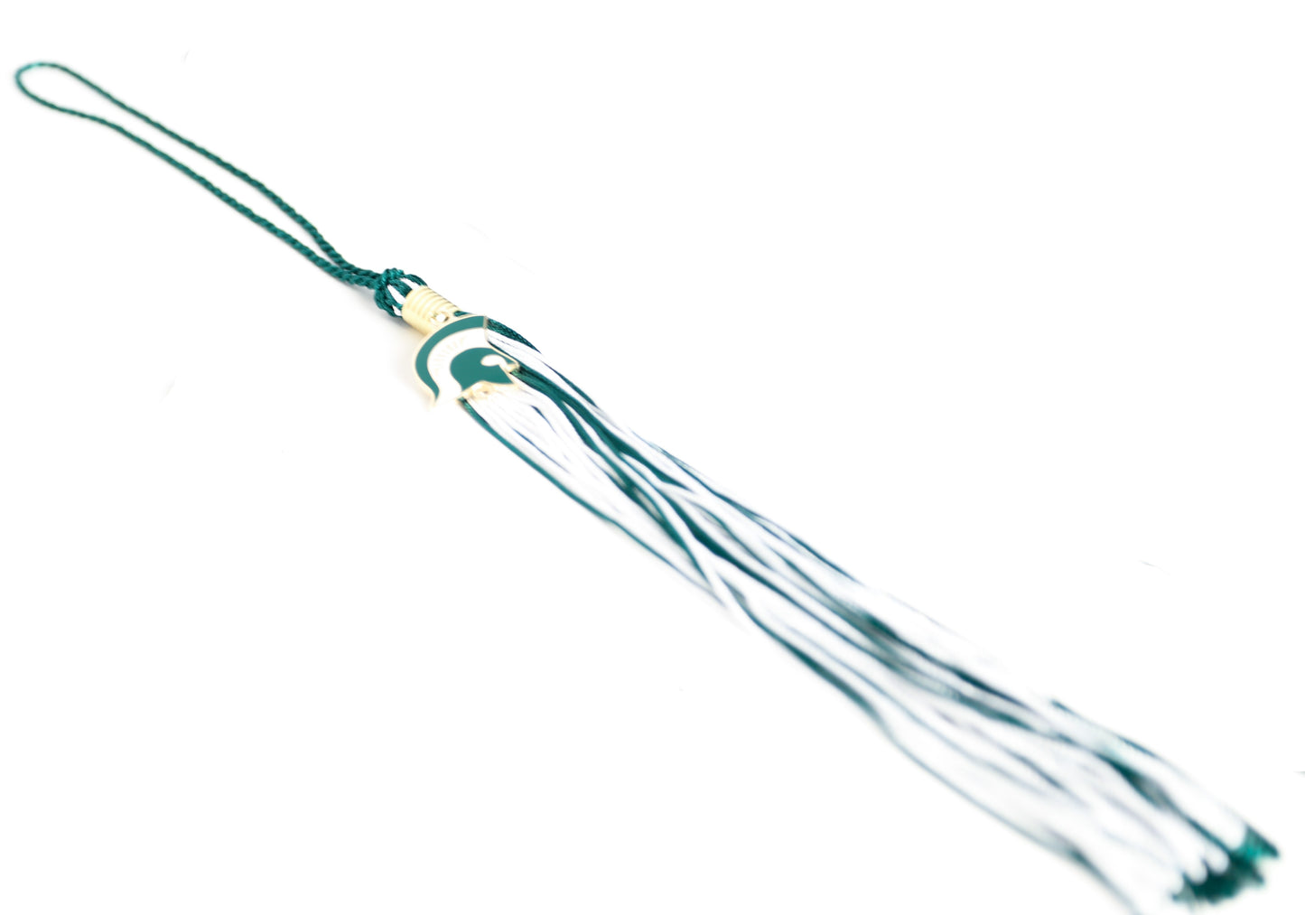 Front of green and white graduation souvenir tassel with gold clasp and a Spartan Helmet charm. Shown on a white background. 