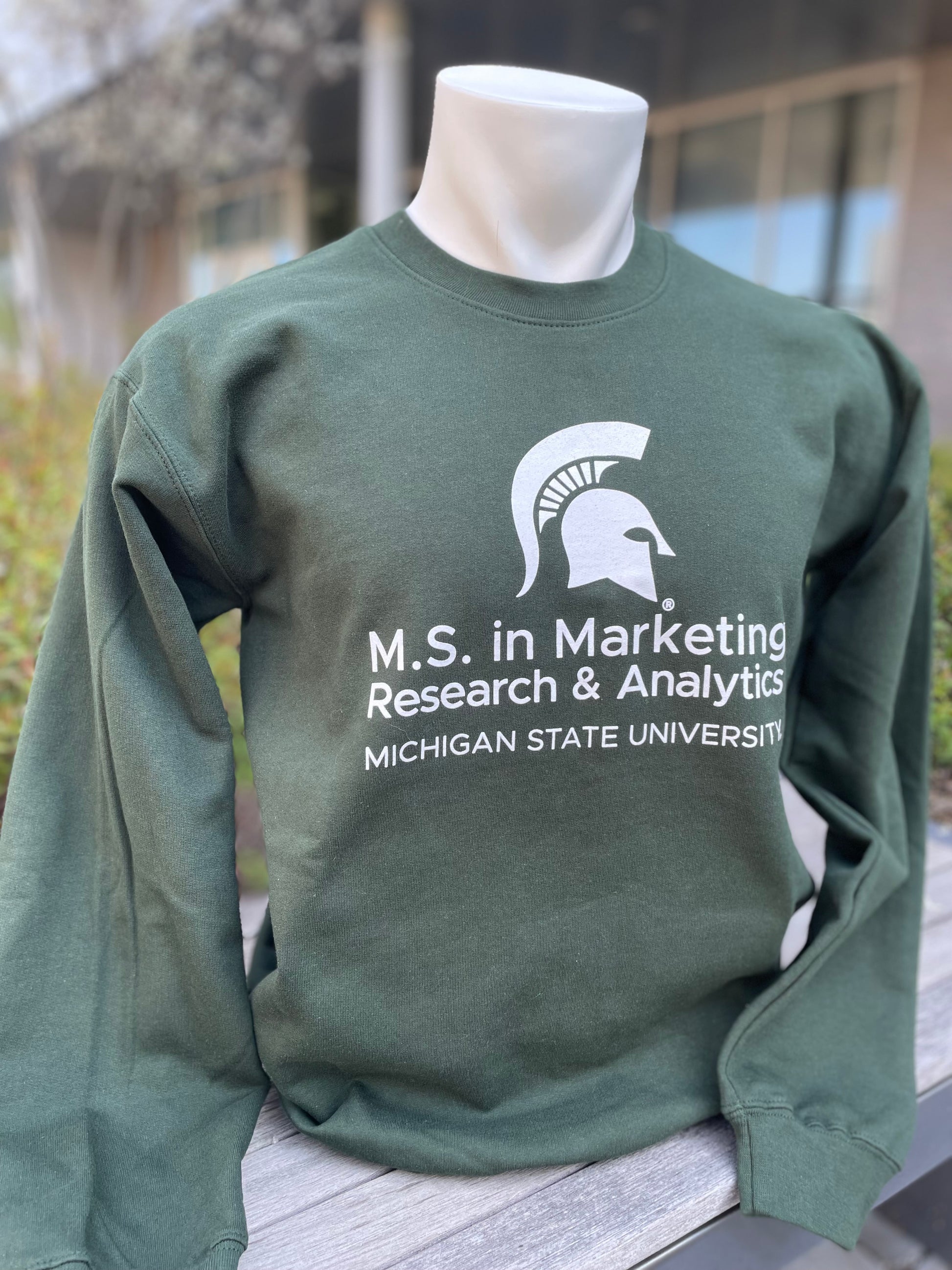 Green crewneck sweatshirt with  the M.S. in Marketing Research & Analytics Michigan State University logo printed in white on the front.