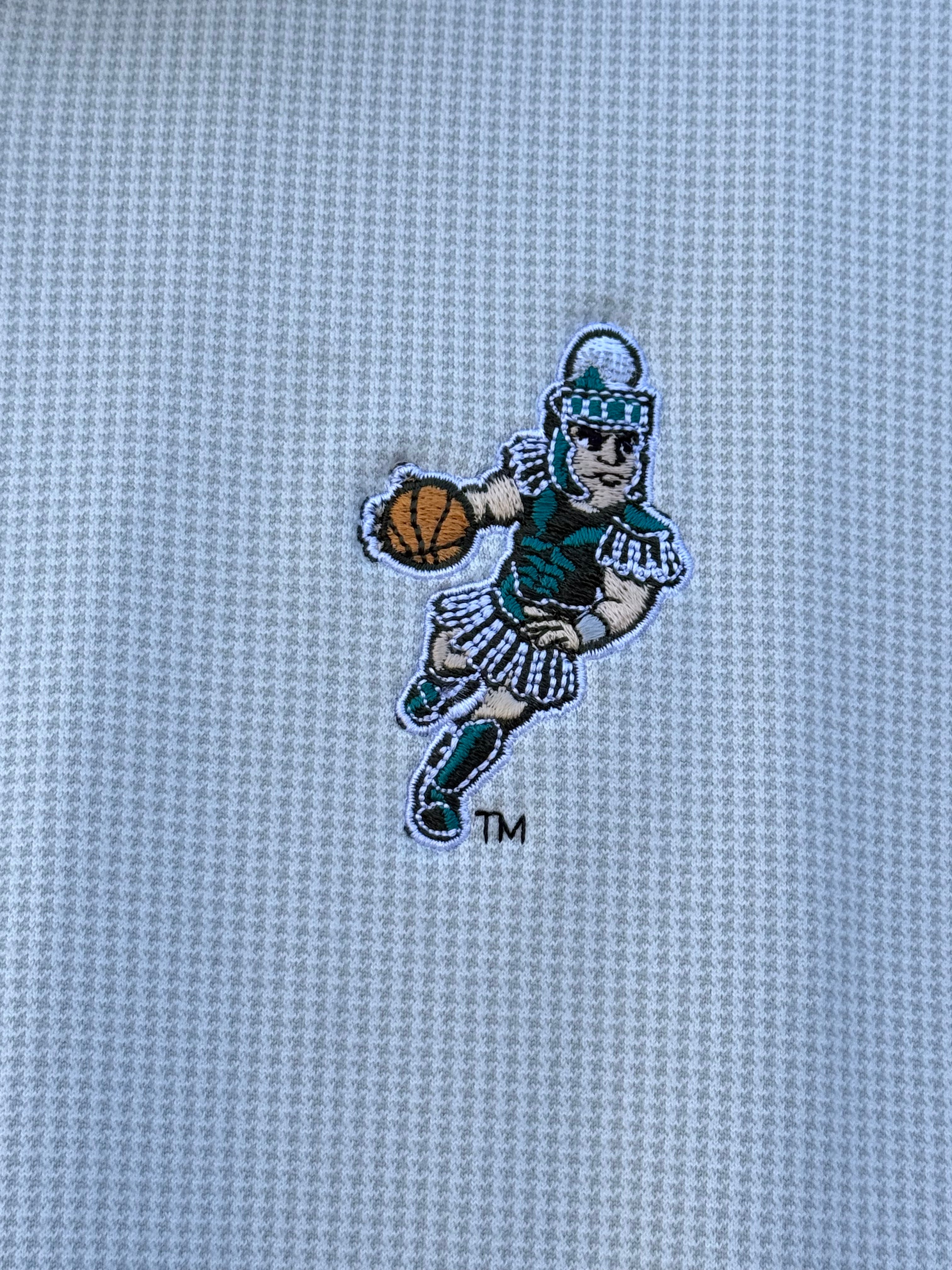 Close up of the embroidered basketball Sparty logo on the upper left chest. 