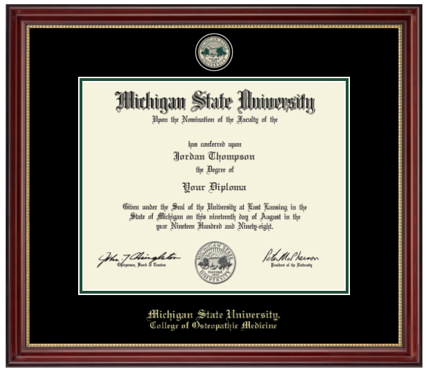 A dark cherry colored frame with gold accent on inner frame. Black matting with green accent surrounding opening for diploma. At top is a gold engraved Michigan State University seal. Bottom of matting in gold letters 'Michigan State University'. Below in gold letters 'College of Osteopathic Medicine'.