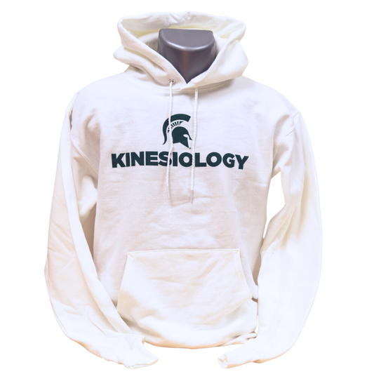 White hooded sweatshirt with green text that reads "Kinesiology" and a green Spartan Helmet logo above the text. The sweatshirt has a large pocket on the front and drawstrings on the hood. Shown on a mannequin. 