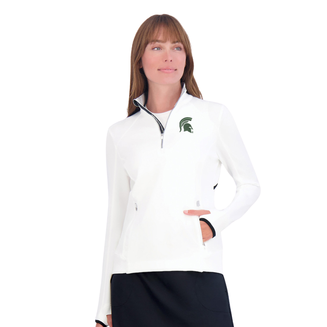 A woman wearing a white golf quarter-zip pullover with a green Spartan Helmet logo on the left side of the chest. The quarter-zip has a pocket in the middle with zippers on each side. 