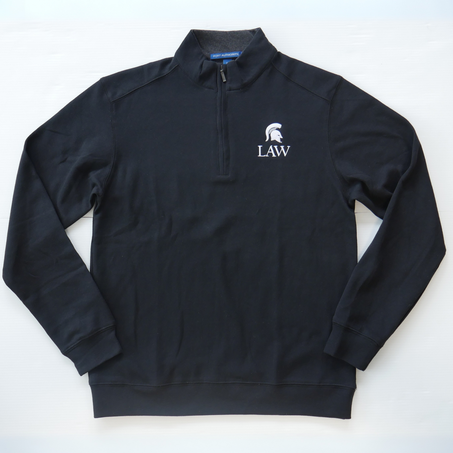 Men's black quarter-zip sweatshirt with a Spartan Helmet logo above a "Law" wordmark in white on the left upper chest. Shown on a white a background.