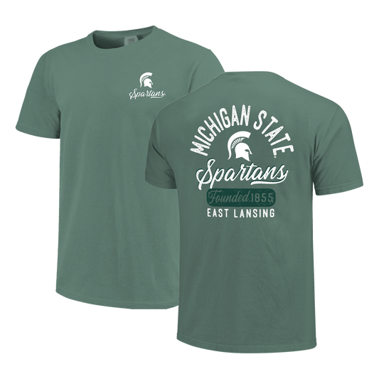 Front and back of a green T-shirt. On the left side of the image is the front of a green T-shirt with a white Spartan Helmet logo and script text that reads "Spartans" in white. On the right side of the screen is the back of a green T-shirt with arched text that reads "Michigan State," a Spartan Helmet logo, script text that reads "Spartans," green cut out text that reads "Founded 1855," and white text that reads "East Lansing."