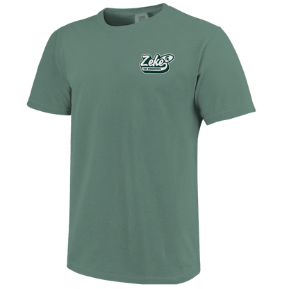 Front of a green T-shirt with bubbled text that reads "Zeke the Wonderdog" on the upper left chest. 