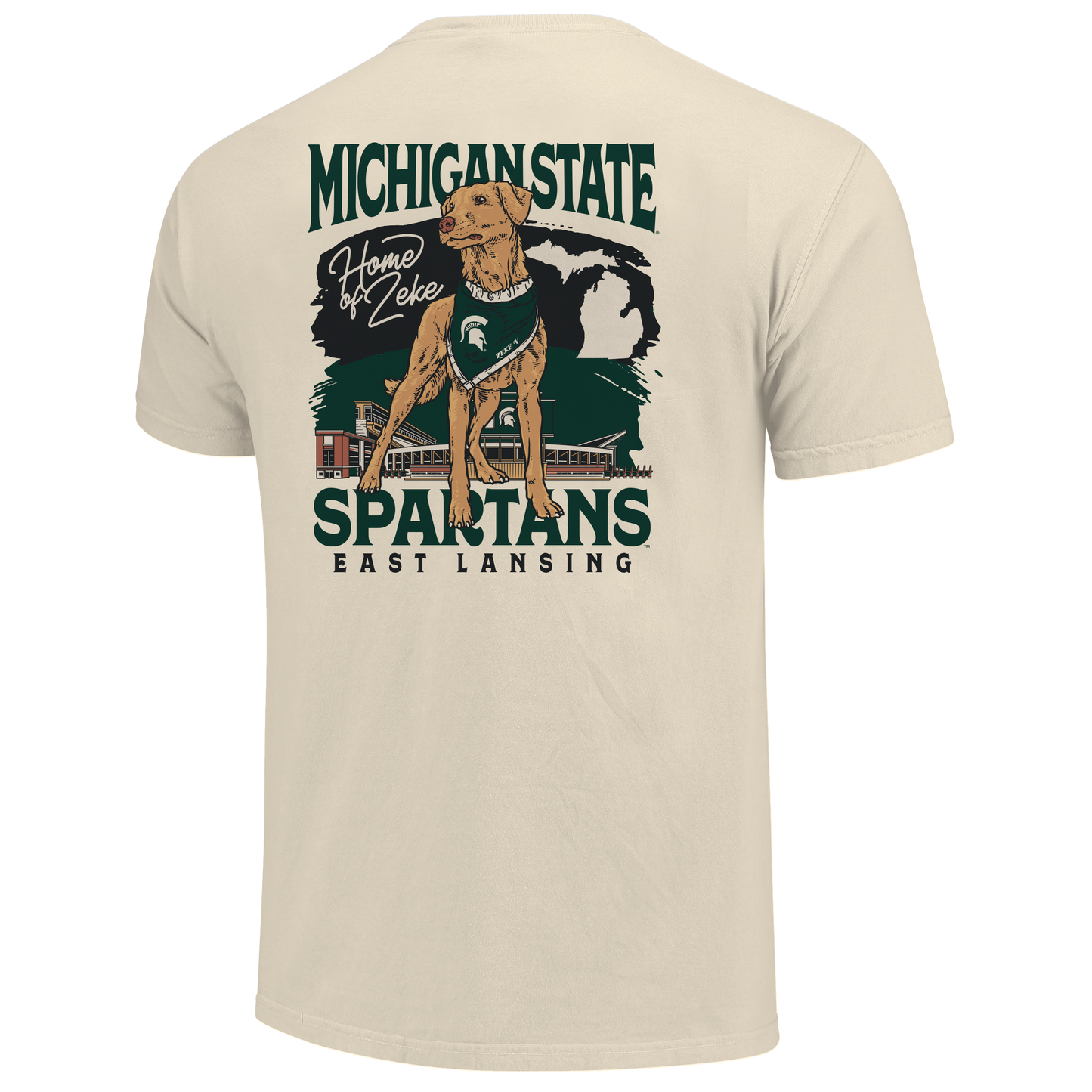 Back of a cream T-shirt with Zeke the dog on it and text that reads "Home of Zeke" next to it. Behind the dog graphic is a MSU themed design with stacked text below that reads "Spartans East Lansing."