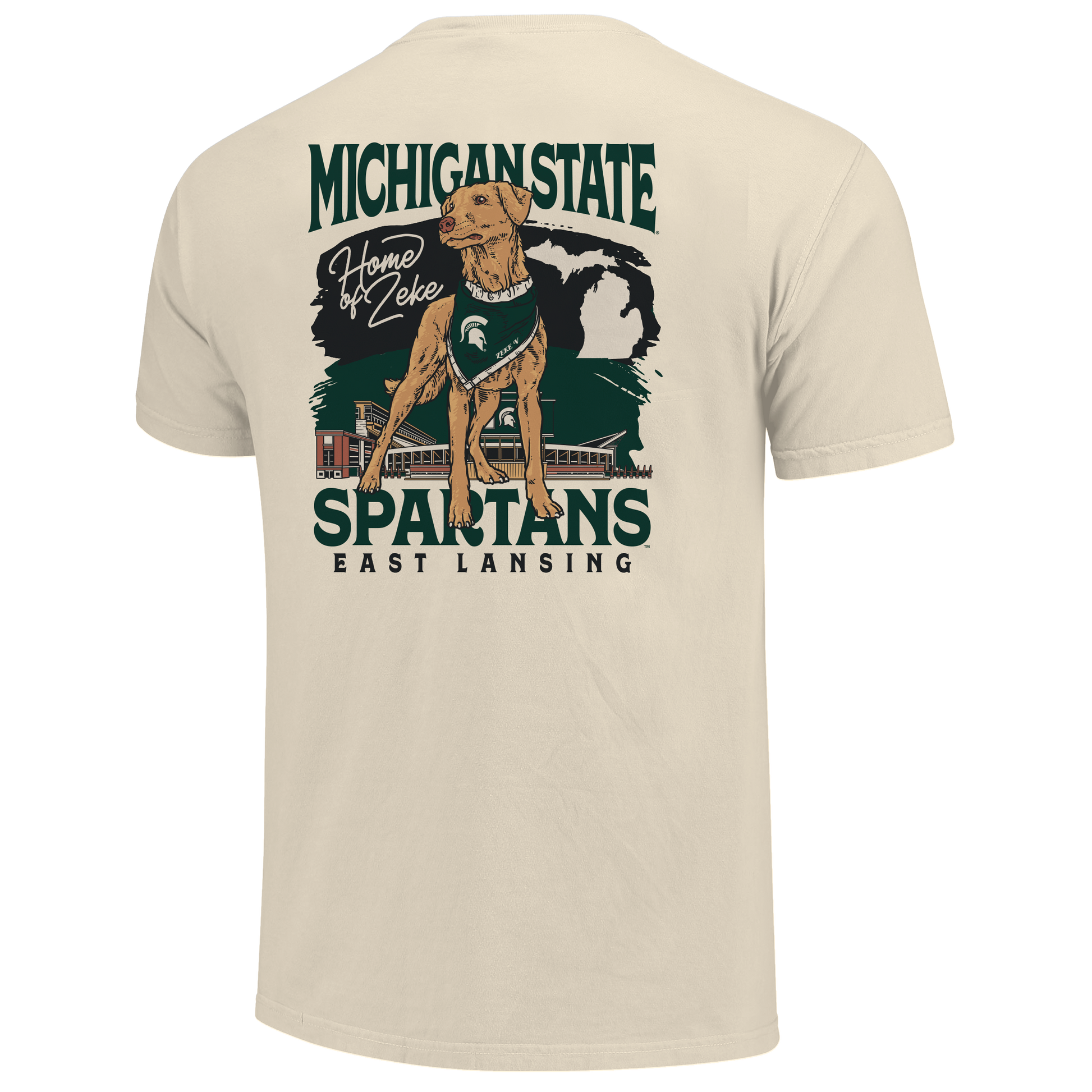 Back of a cream T-shirt with Zeke the dog on it and text that reads "Home of Zeke" next to it. Behind the dog graphic is a MSU themed design with stacked text below that reads "Spartans East Lansing."