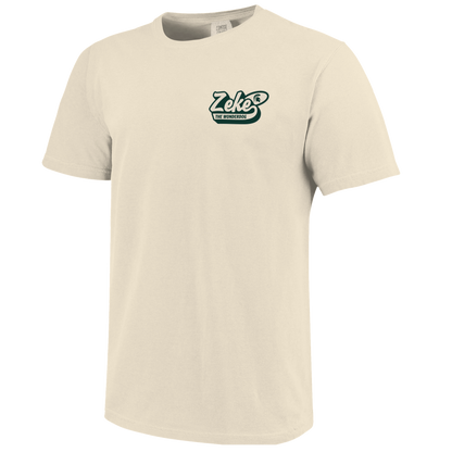 Front of a cream T-shirt with bubbled text that reads "Zeke the Wonderdog" on the upper left chest. 