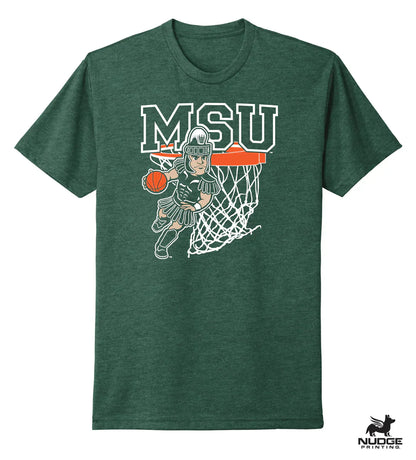 A green shirt with a design showing Sparty playing basketball below large text that reads "MSU."