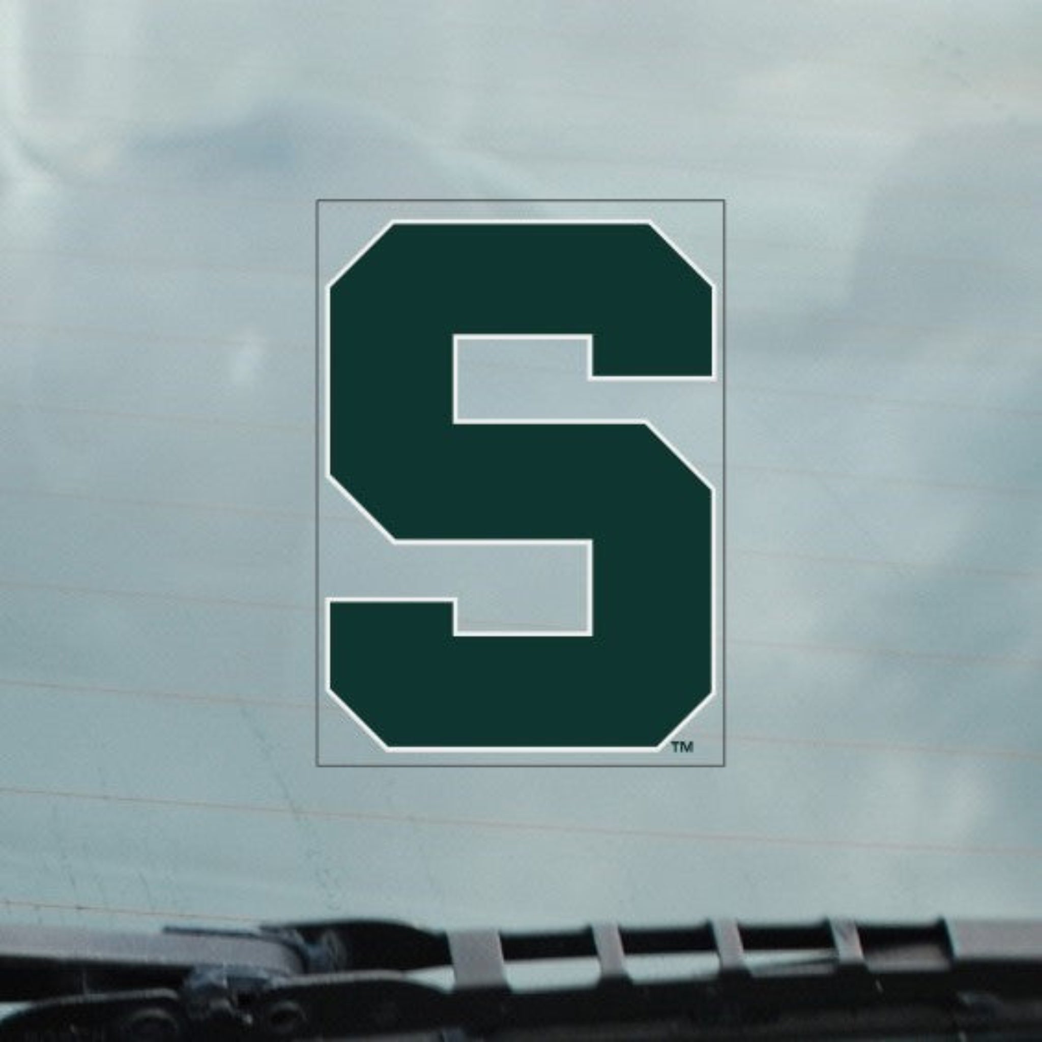 Green block 'S' decal that is outlined in white. 