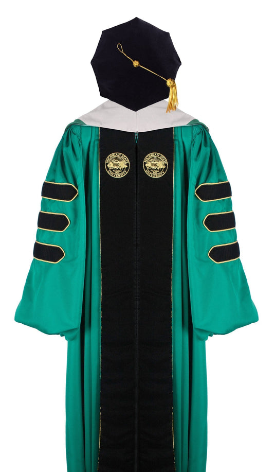 Green doctoral academic regalia gown with black velvet panels, gold piping, and three black velvet sleeve bars. Features two gold embroidered seals on the front and includes a black velvet tam with a gold tassel.