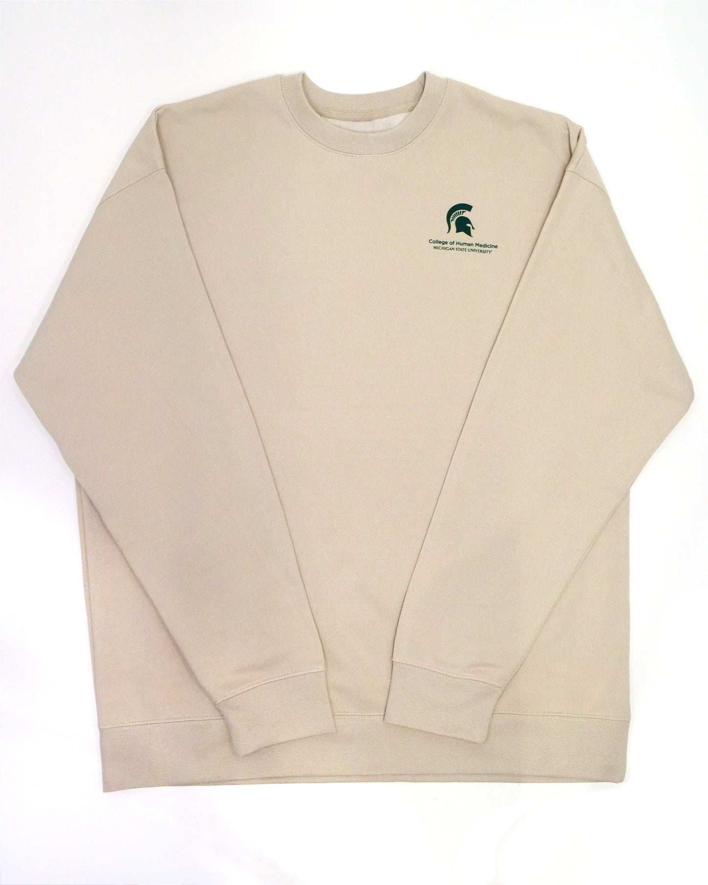 The front of a cream crewneck sweatshirt. In the top left corner is a green Spartan Helmet logo with the words "College of Human Medicine, Michigan State University" written in green underneath. 