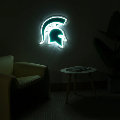 LED Spartan Helmet wall sign shown lit up in a dimly lit room.