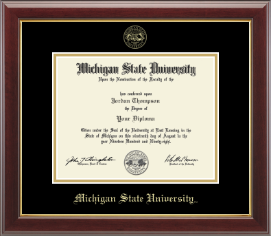 The diploma is mounted on a black matte background with a gold-trimmed frame. With gold Michigan State University seal at top of Matte. At bottom of matte in gold letters is 'Michigan State University'.