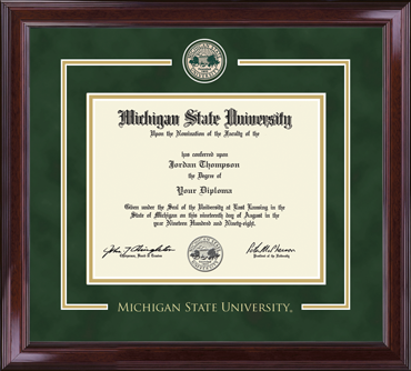 diploma is enclosed in a dark brown wood frame with green matting and gold accents. 'MICHIGAN STATE UNIVERSITY' is printed at the bottom of the frame. Gold embossed Michigan State University at top of matting.