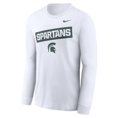 A white long sleeve T-shirt with a dark green block graphic in the middle. Inside the block graphic, written in white, is the word "Spartans." Underneath the block graphic is a green Spartan Helmet logo. 