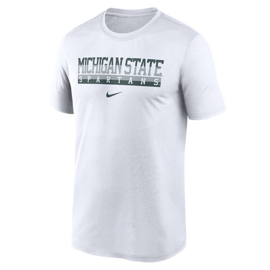 White Nike short-sleeve T-shirt featuring a distressed dark green “MICHIGAN STATE SPARTANS” wordmark centered across the chest. The design includes diagonal stripe detailing through the lettering, with a dark green Nike Swoosh logo positioned below the text.